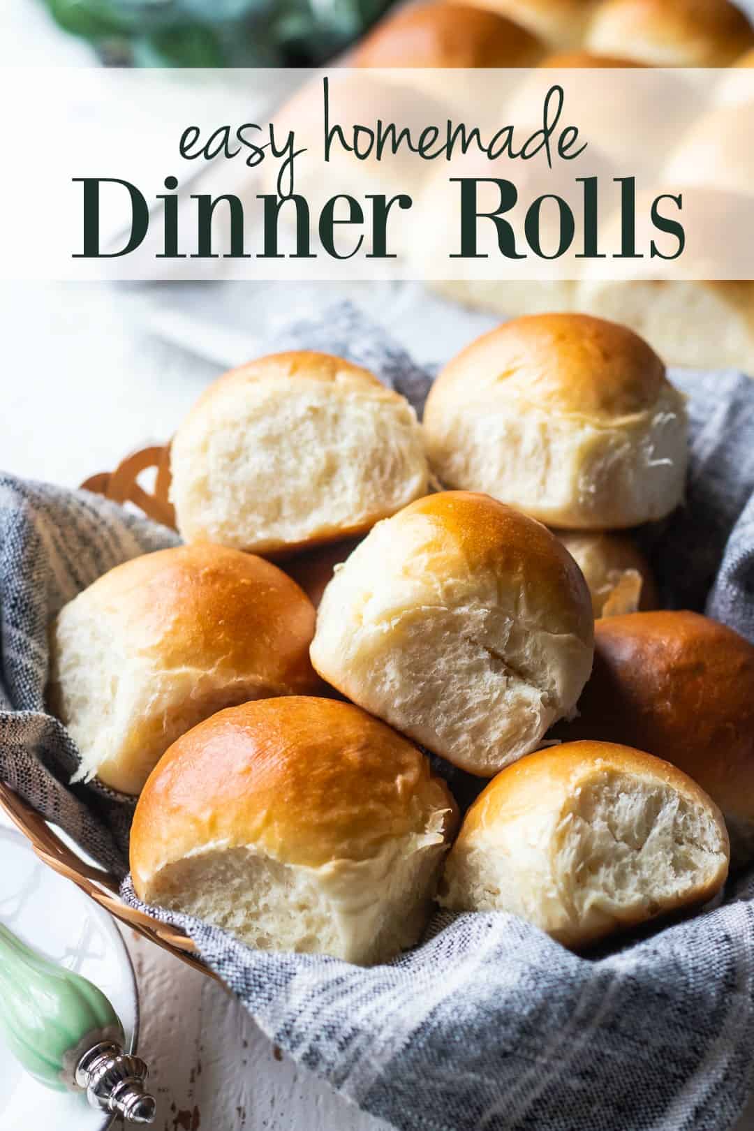 Basket of soft homemade dinner rolls with a text overlay above that reads "Easy Homemade Dinner Rolls."