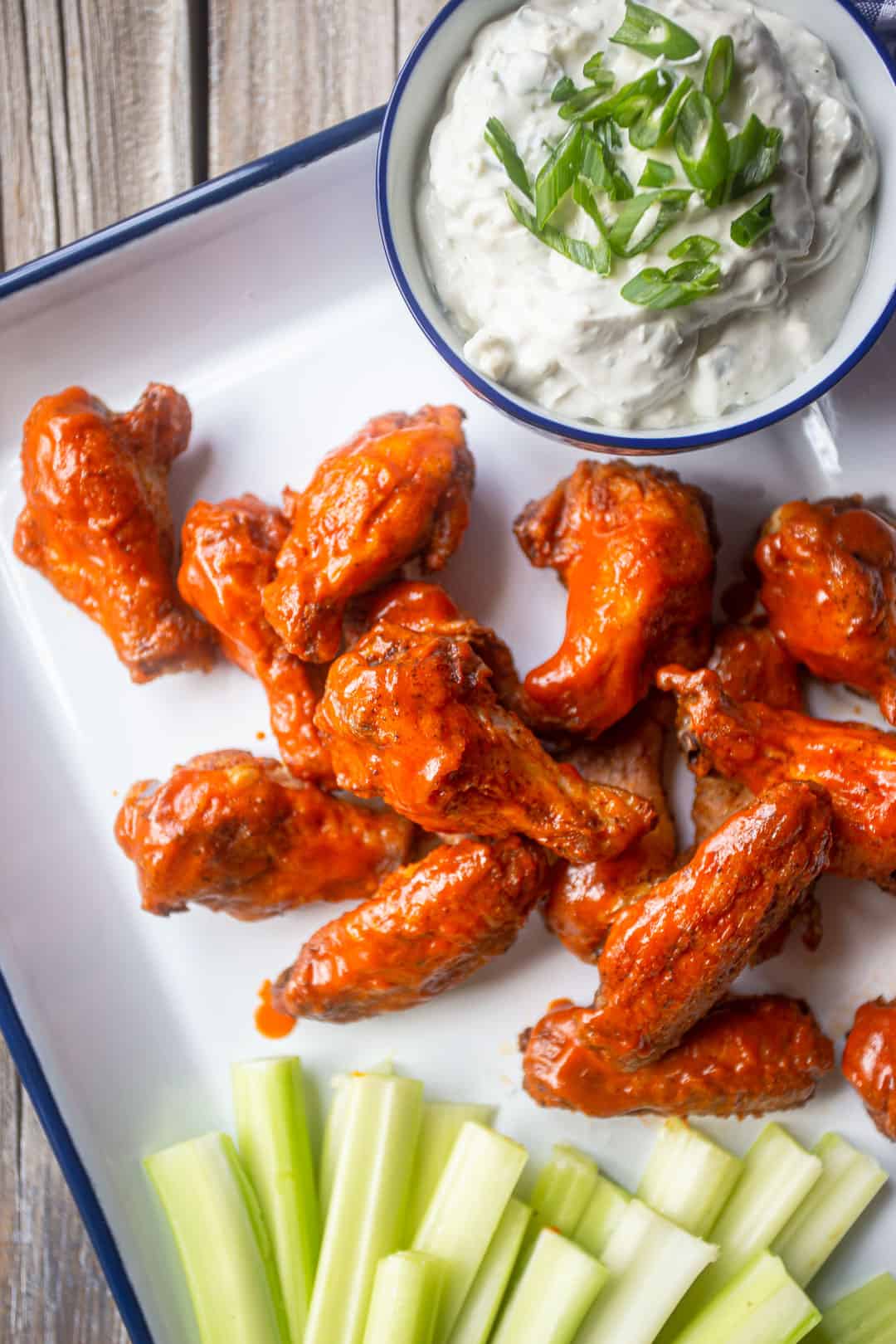 Chicken wings recipe prepared buffalo style, with blue cheese and celery.