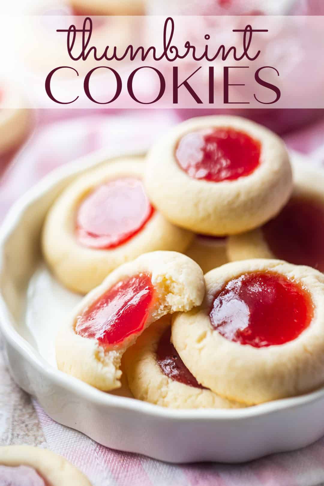 Thumbprint cookie recipe prepared and served in a white ceramic dish with a text overlay above reading "Thumbprint Cookies."