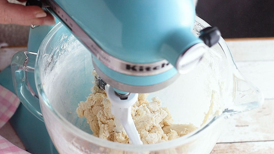 Thumbprint cookie dough in a stand mixer.