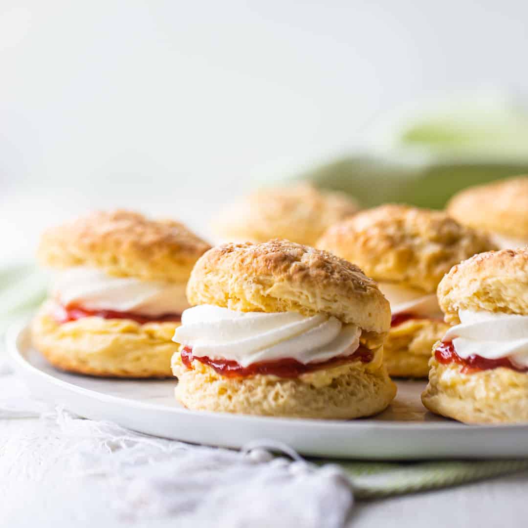Irish scones on a white platter with a pale green napkin.