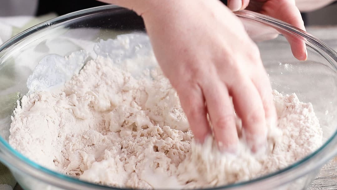 Making Irish soda bread dough with your hands.