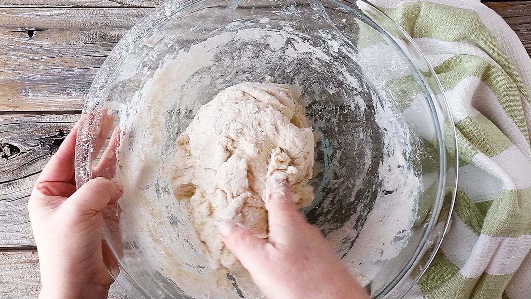 Forming Irish soda bread dough into a ball.