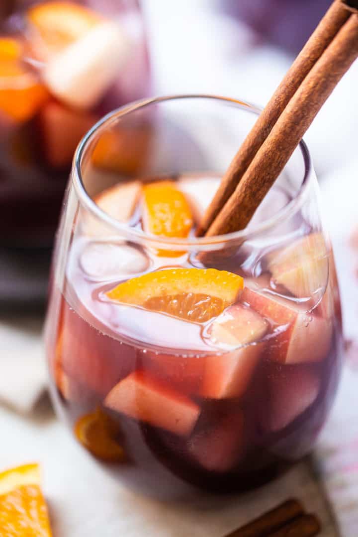 How to make sangria served in wine glasses with fresh fruit and cinnamon.