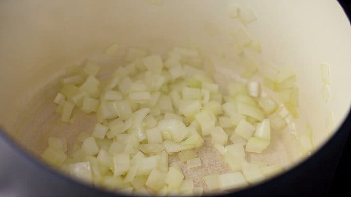 Sauteing onion in a large pot until softened.