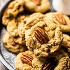 Butter pecan cookies on a plate with a text overlay that reads "Butter Pecan Cookies."