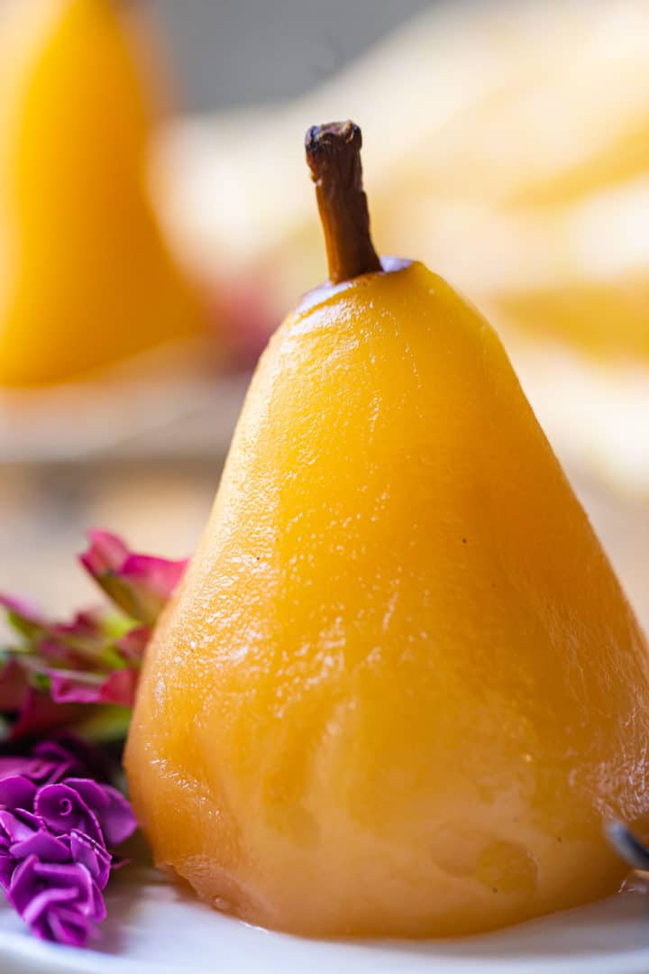 Extreme close-up image of wine poached pears.