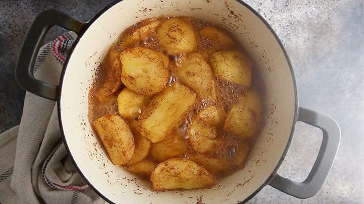 Homemade applesauce simmering in a pot.
