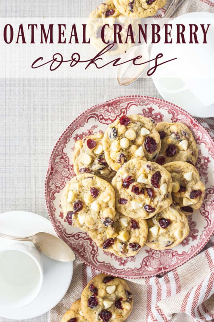 Overhead image of a plate of white chocolate cranberry cookies, with a text overlay that reads "Oatmeal Cranberry Cookies."