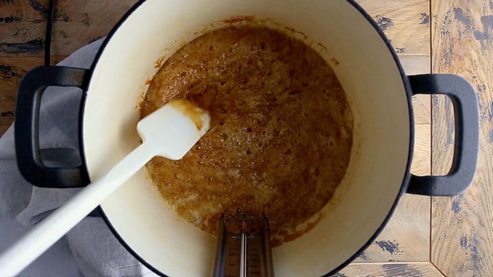 Cooking toffee to the color of peanut butter.