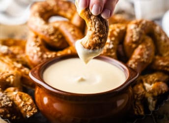 Dipping a homemade soft pretzel into beer cheese.