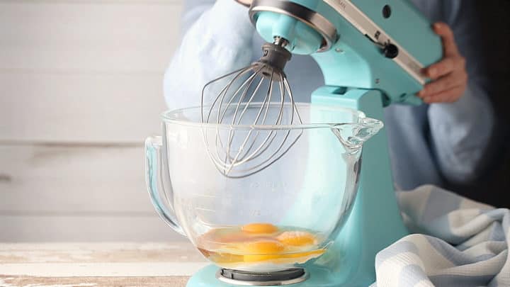 Sugar, eggs, vanilla, and salt in the bowl of a stand mixer fitted with the whisk attachment.