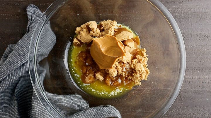 Brown sugar, melted butter, and peanut butter in a large glass bowl.