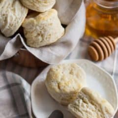 souther style biscuits on white plate with honey on white plates