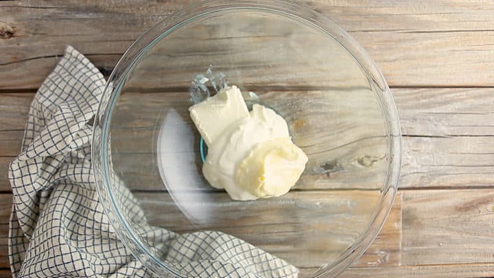 Cream cheese, mayonnaise, and sour cream in a large mixing bowl.