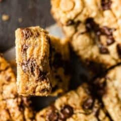 chewy peanut butter blondies on parchment paper