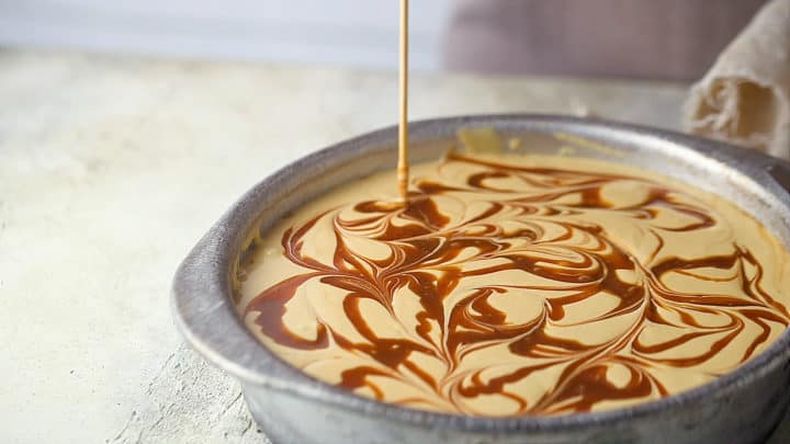 Swirling caramel sauce through cheesecake batter.