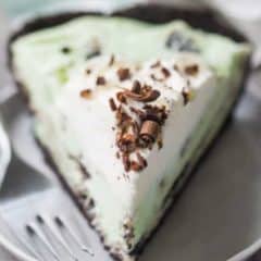 slice of green grasshopper pie on plate with fork