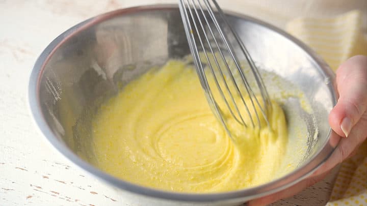Whisking eggs into cornstarch mixture.