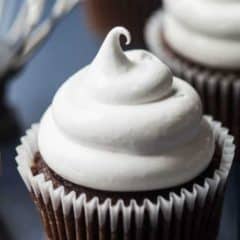 Chocolate cupcake topped with marshmallow frosting.