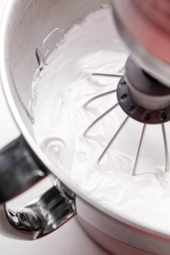 Whipping marshmallow filling in a stand mixer.
