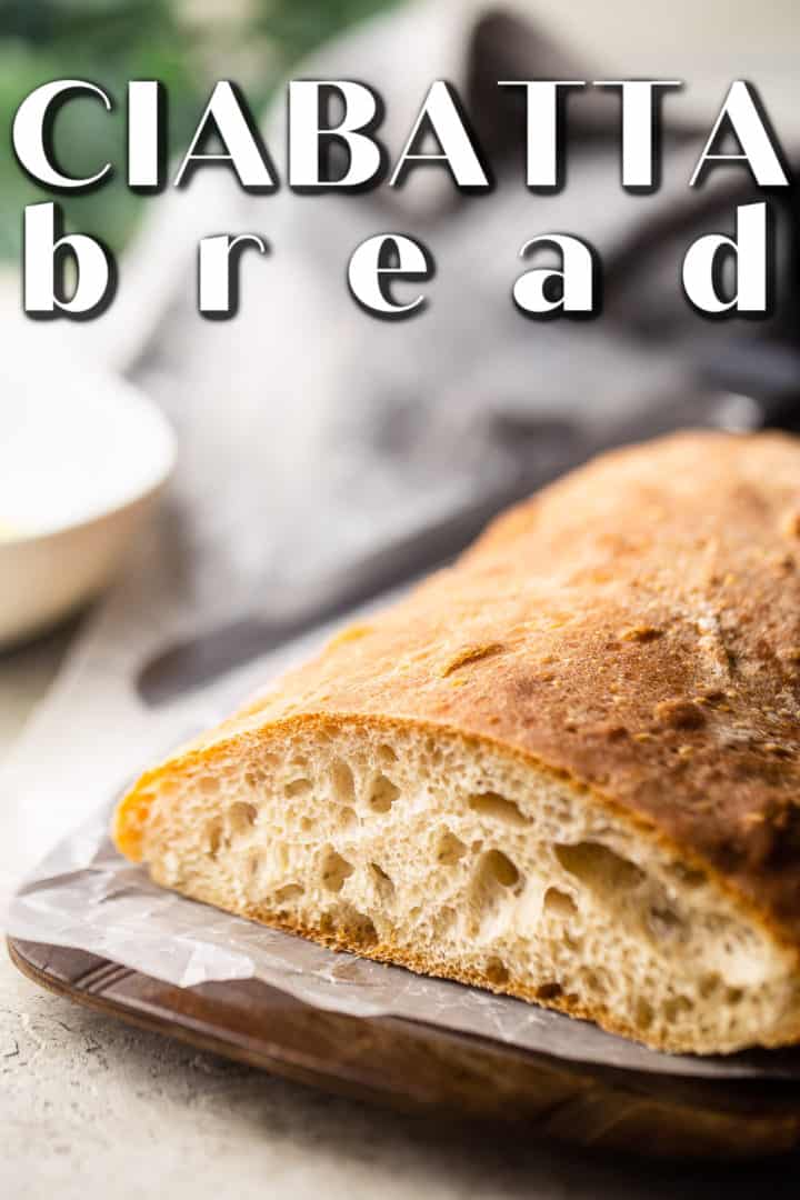 Ciabatta bread on a wooden serving board with a striped napkin and a text overlay that reads "Ciabatta Bread."