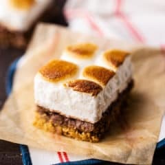 S'mores bar on a piece of parchment with a striped napkin.