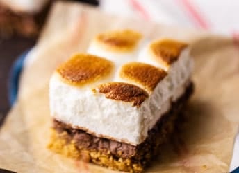 S'mores bar on a piece of parchment with a striped napkin.