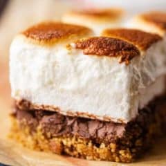 Horizontal image of s'mores bar highlighting the layers of graham, chocolate, & marshmallow.