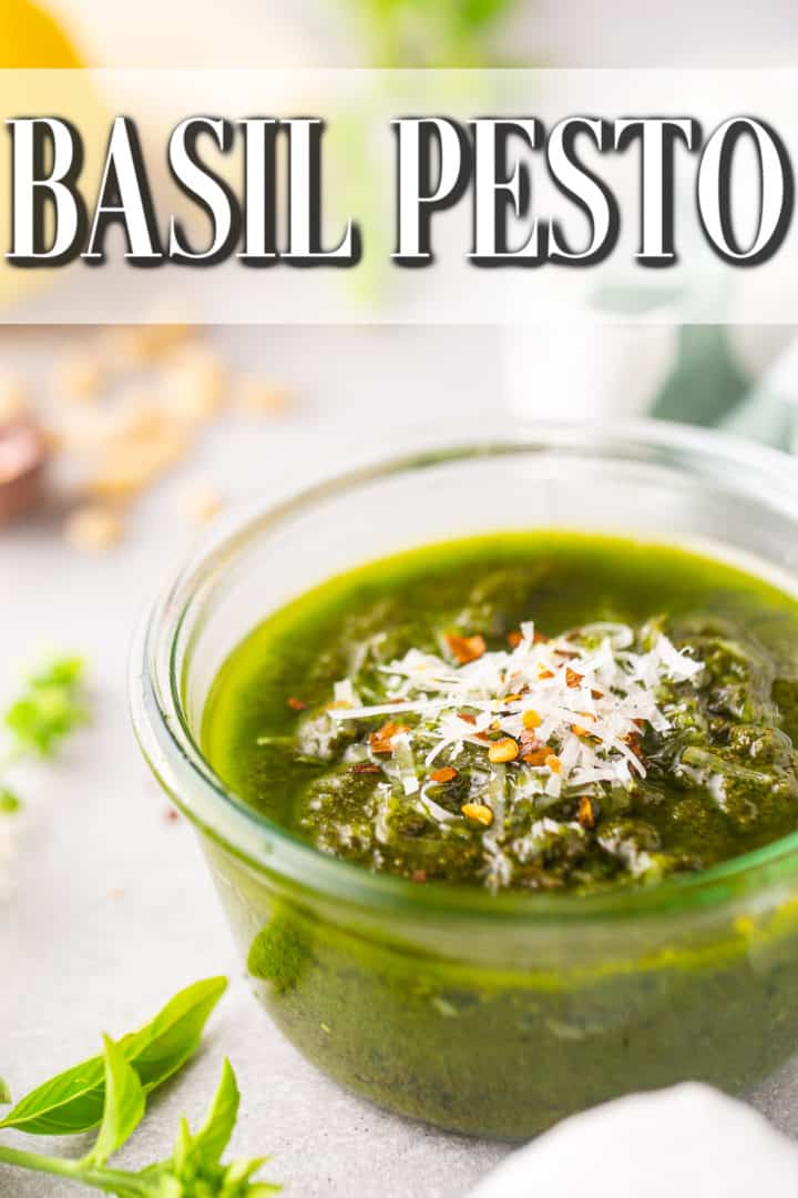 Pesto with parmesan cheese and crushed red pepper, in a glass vessel with a text overlay that reads "Basil Pesto."