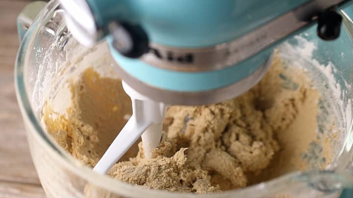 Brown sugar cookie dough in a stand mixer.