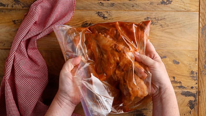 Chicken brining in a zip-top plastic bag.