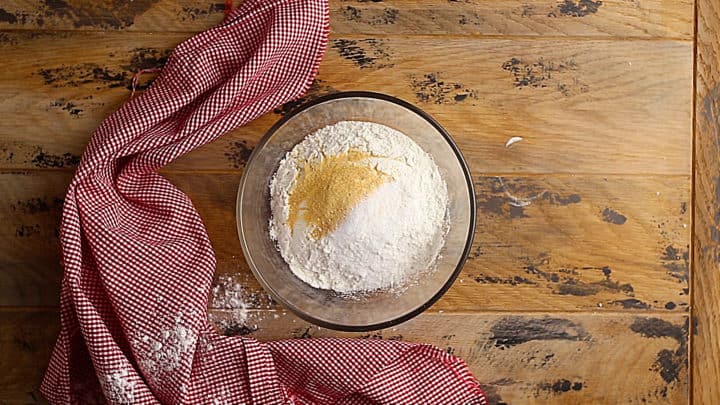 Flour, garlic powder, and salt in a medium glass bowl.
