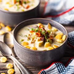 Clam chowder in a gray stoneware bowl.