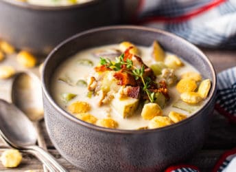Clam chowder in a gray stoneware bowl.