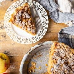 Overhead image of Dutch apple pie served on a distressed wooden surface.