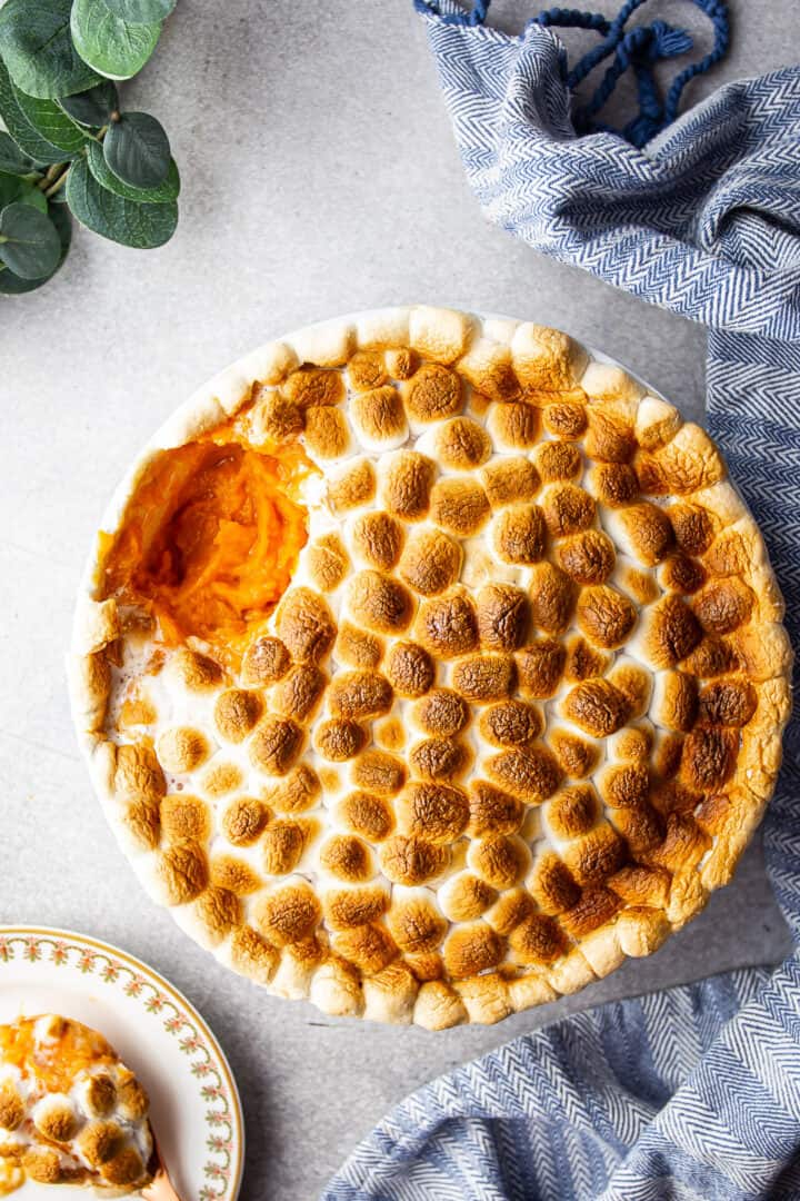 Overhead image of sweet potato casserole recipe, prepared and served in a round souffle dish.