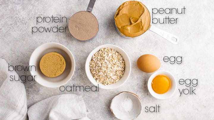 Ingredients for making protein cookies, measured into small bowls.