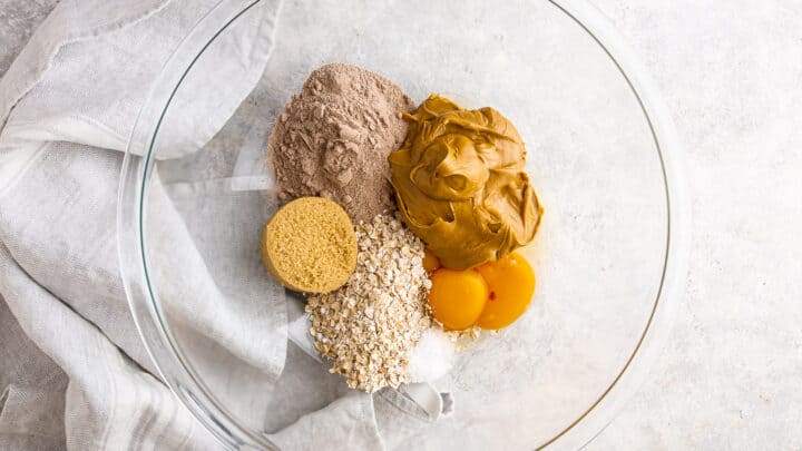 Ingredients for making protein cookies, measured and placed in a large mixing bowl.