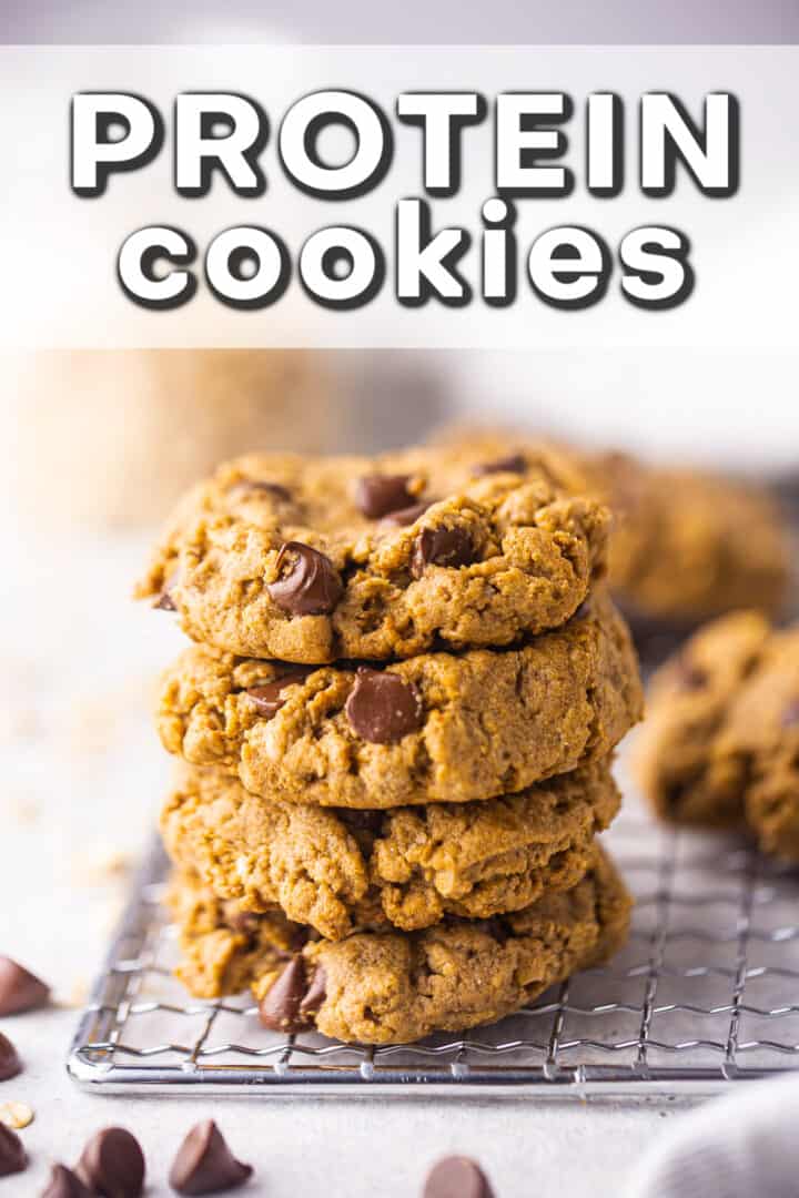 Healthy protein cookie recipe, baked and stacked on a wire cooling rack.