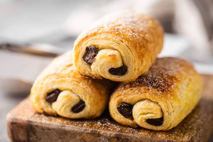 Chocolate croissant recipe, baked and garnished with powdered sugar.