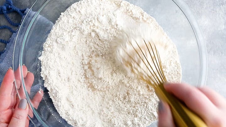 Whisking the dry ingredients together for croissants.
