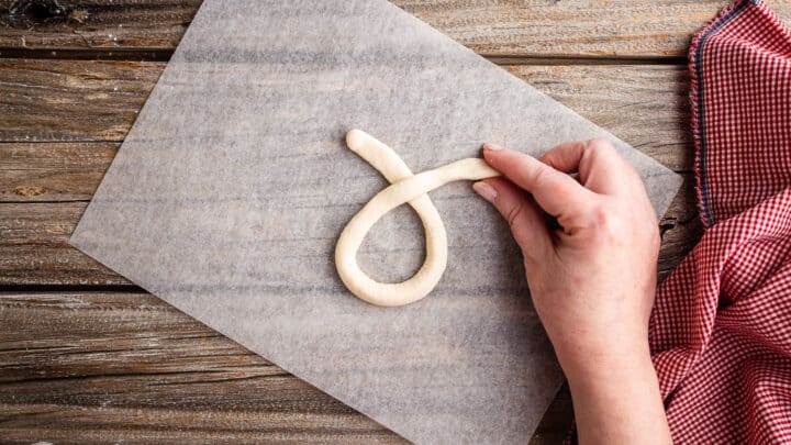 Creating a loop with garlic knot dough.