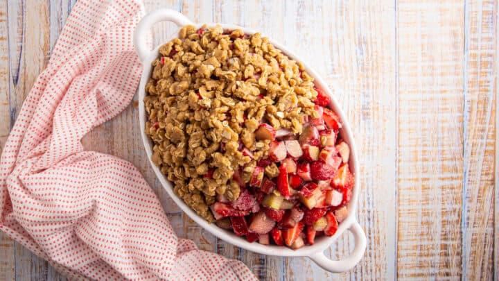 Topping strawberry rhubarb crisp with a brown sugar streusel.