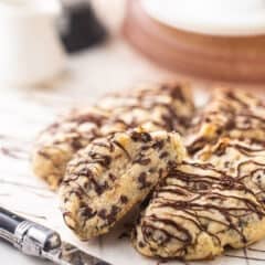 Chocolate chip scones drizzled with melted chocolate.