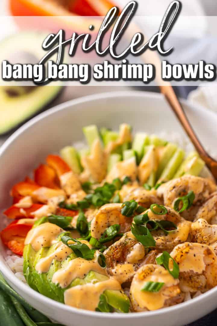 Bang bang shrimp recipe prepared and served in a bowl with rice and vegetables.