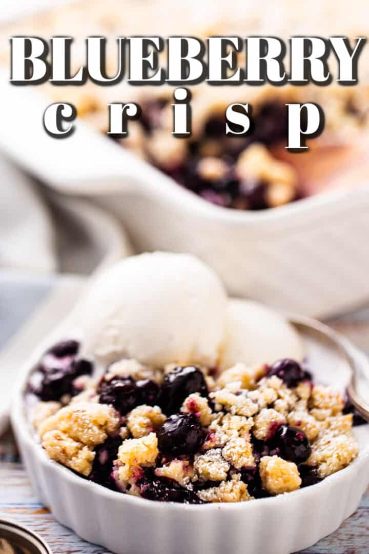 Blueberry crisp recipe, baked and spooned into a shallow dish and topped with vanilla ice cream.