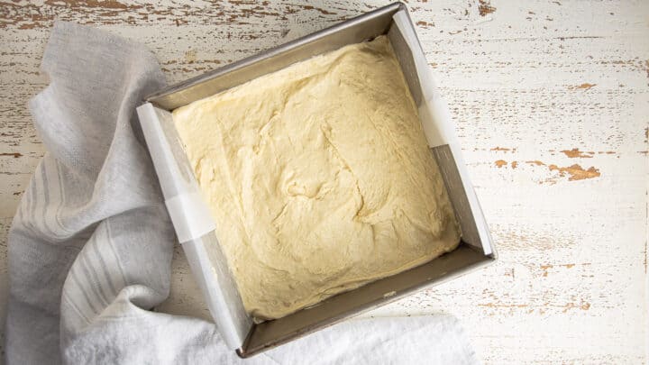 Gooey butter cake dough in pan before rising.