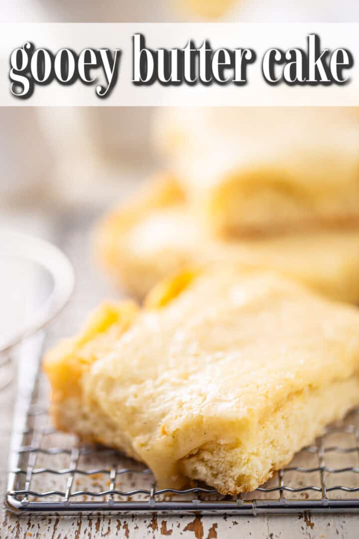 Ooey gooey butter cake on a wire rack with a text banner.