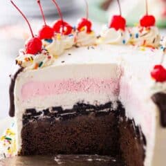 Copycat Dairy Queen ice cream cake with slices cut out so the layers inside can be seen.